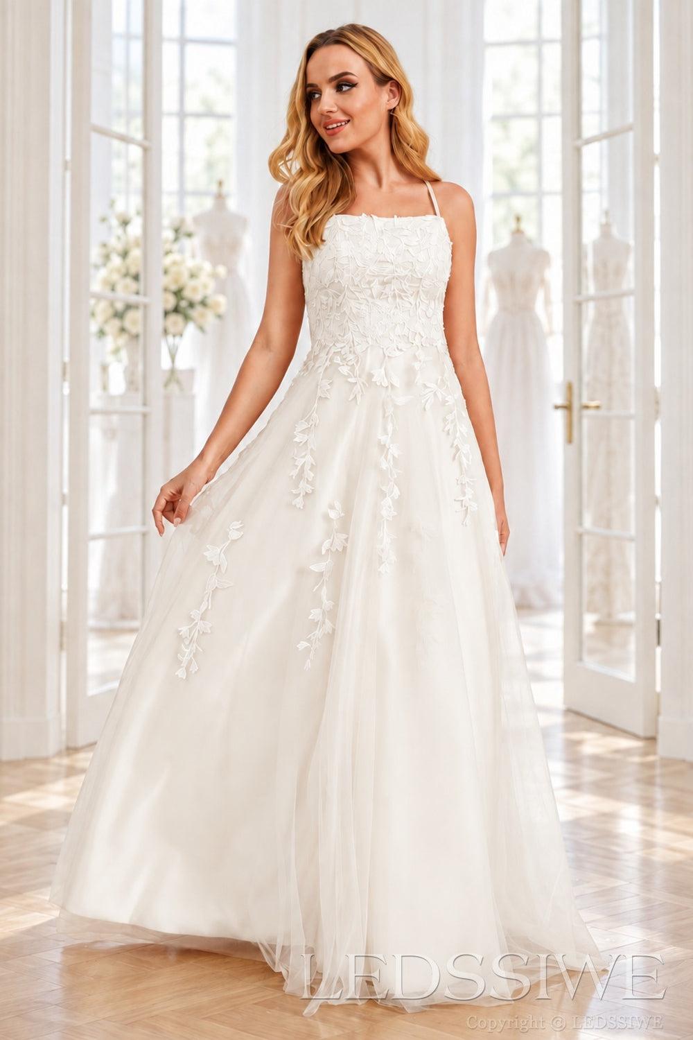 Ivory tulle a-line prom dress with lace appliqués and lace-up back