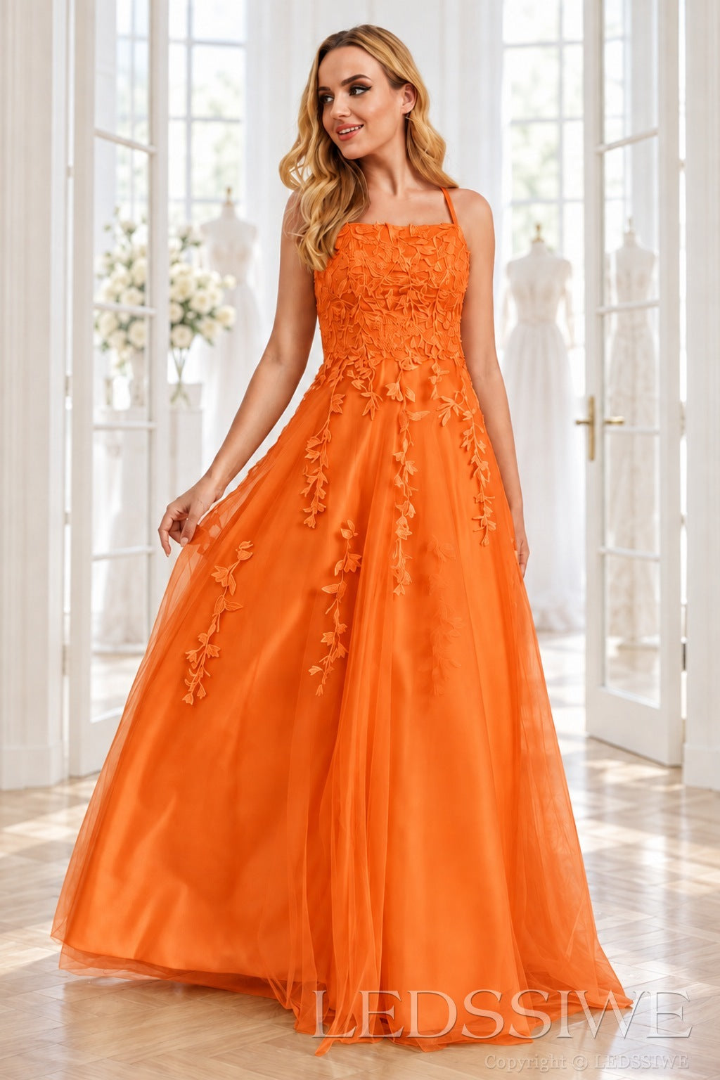 Orange tulle a-line prom dress with lace appliqués and lace-up back