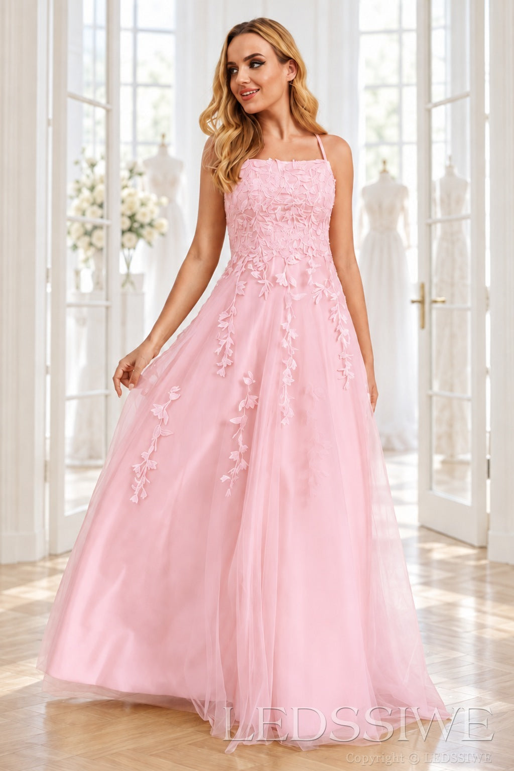 Pink tulle a-line prom dress with lace appliqués and lace-up back
