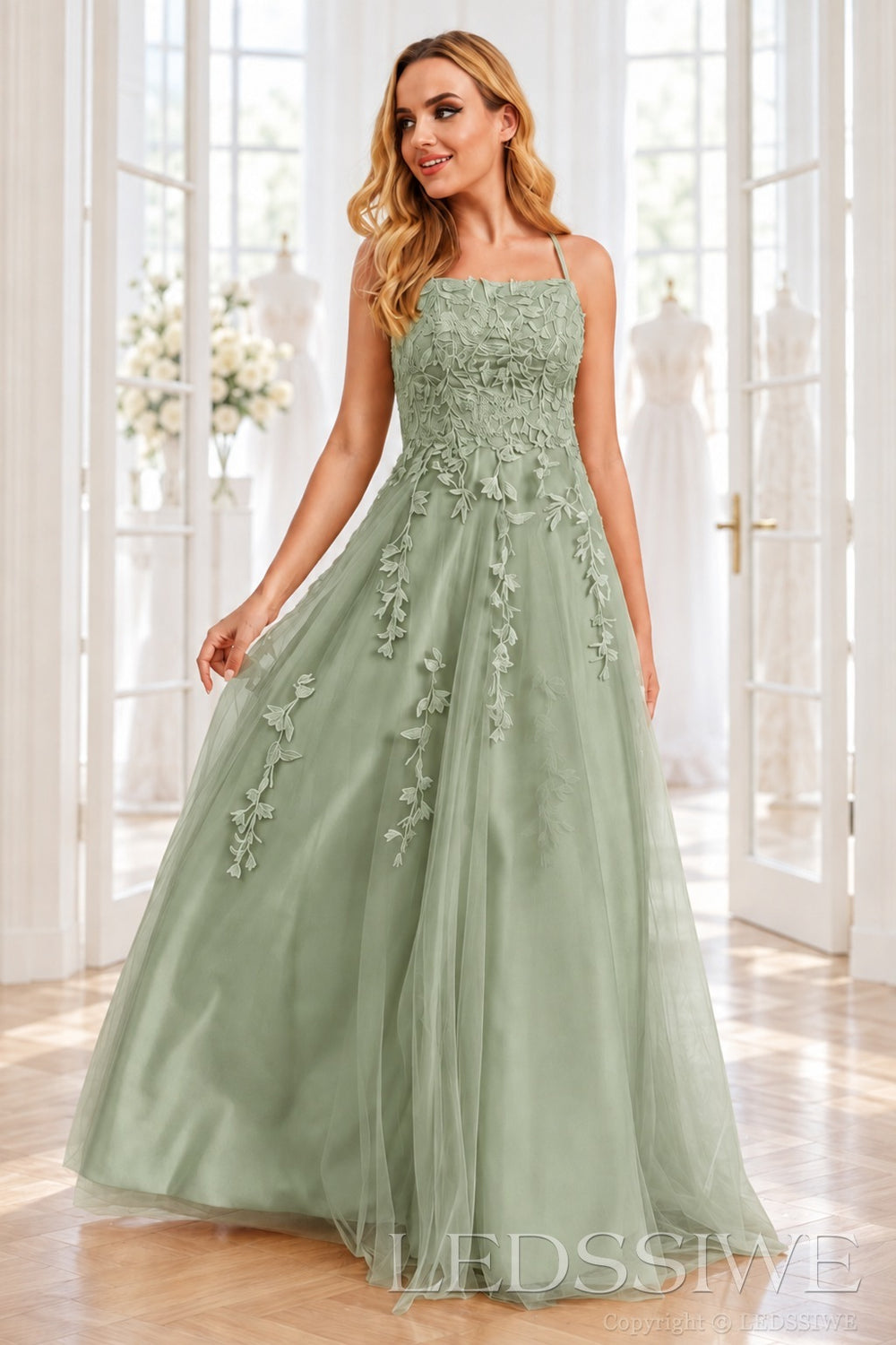 Sage tulle a-line prom dress with lace appliqués and lace-up back