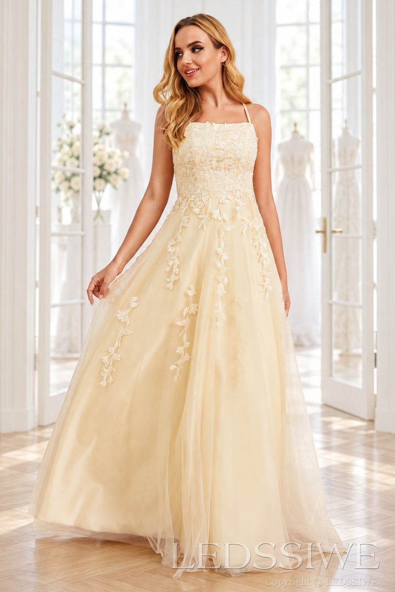 Daffodil tulle a-line prom dress with lace appliqués and lace-up back front view