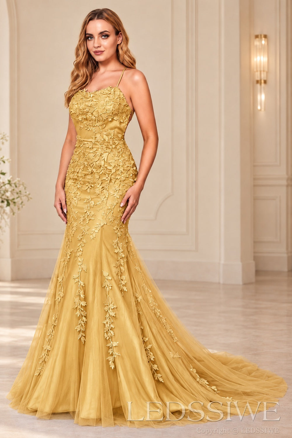 Gold mermaid tulle prom dress with lace appliqués and lace-up open back