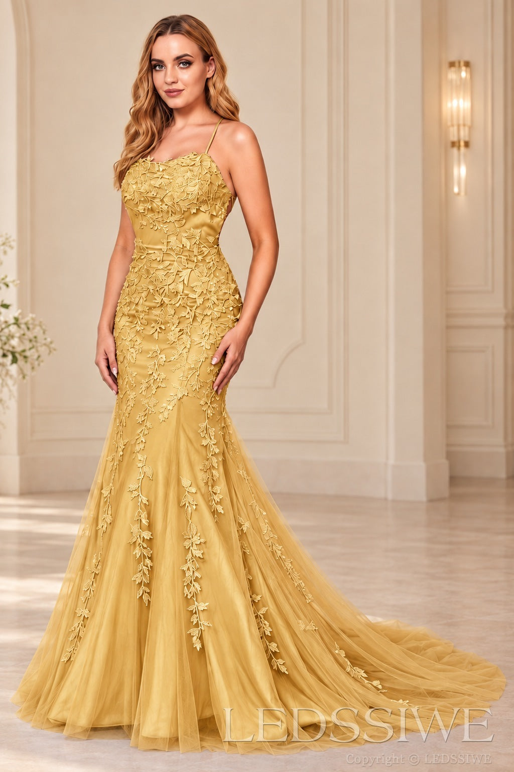 Gold mermaid tulle prom dress with lace appliqués and lace-up open back