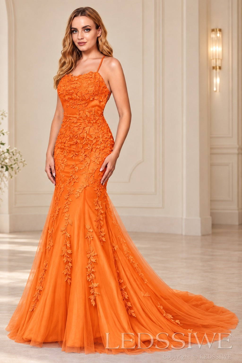 Orange mermaid tulle prom dress with lace appliqués and lace-up open back