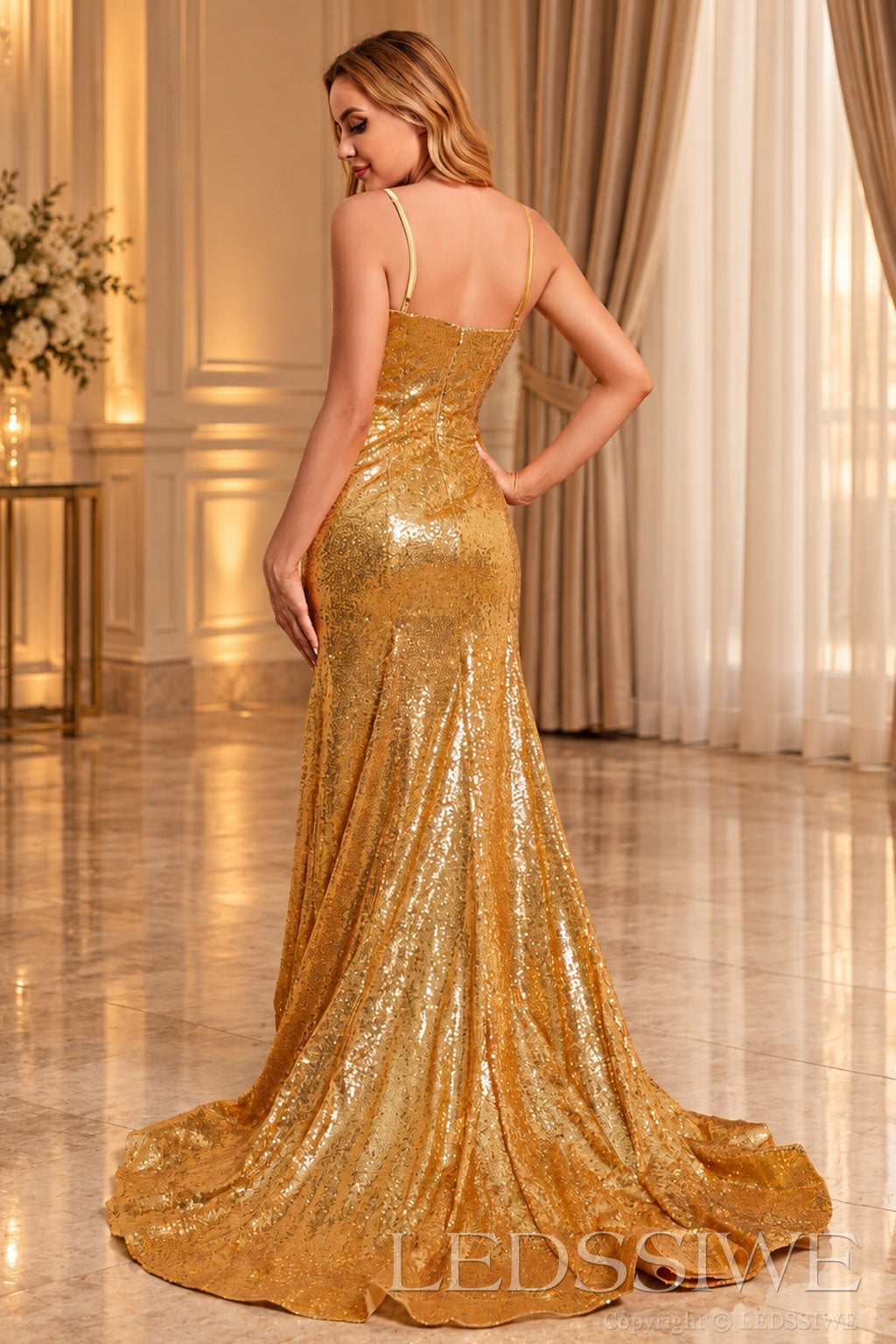 Gold spaghetti strap sequin mermaid prom dress with sweep train zipper back view