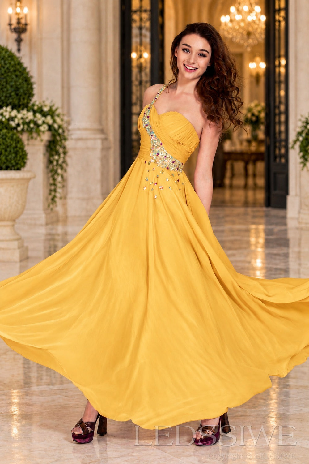 gold chiffon a-line prom dress with beaded sweetheart bodice and spaghetti strap