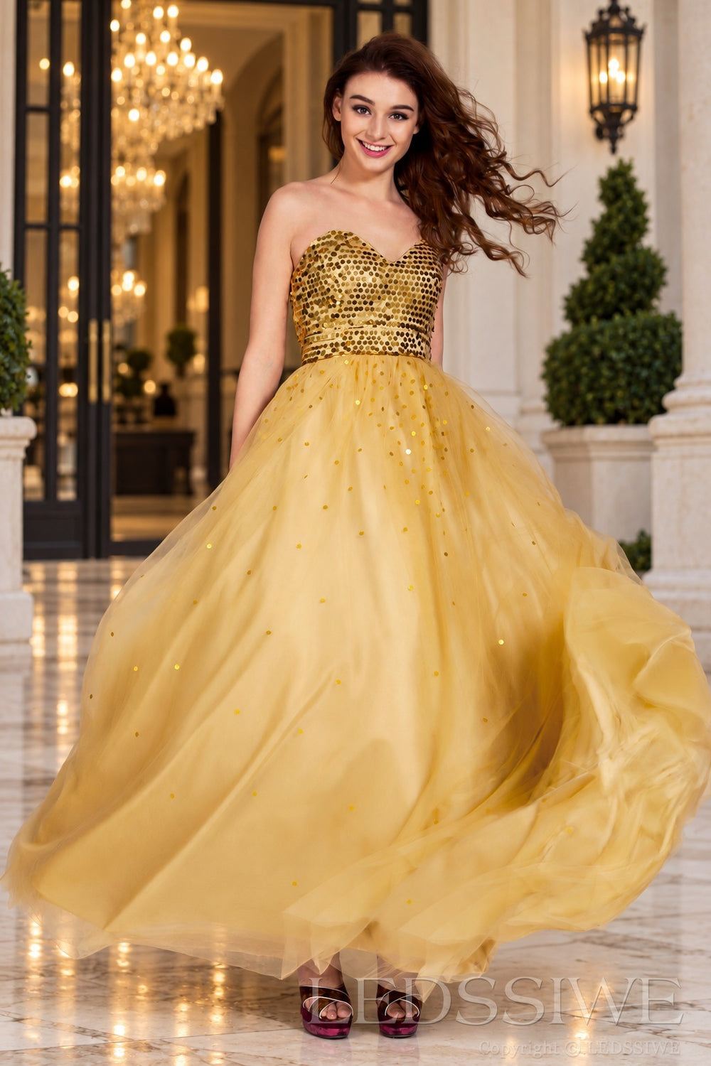 gold strapless sequin sweetheart a-line prom dress with tulle skirt side view