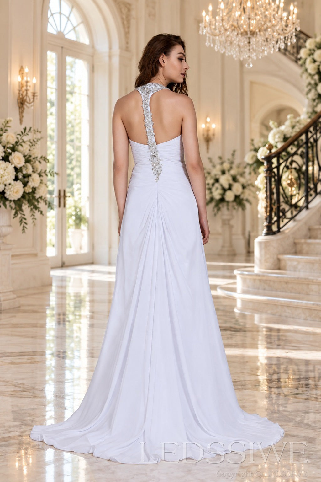 white v-neck chiffon a-line wedding dress with beaded strap and rhinestone detail back view