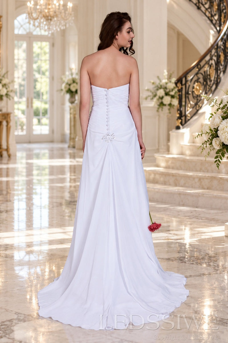 white strapless ruched chiffon a-line wedding dress with beaded hip and cathedral train back view
