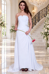 white strapless ruched chiffon a-line wedding dress with beaded hip and cathedral train side view