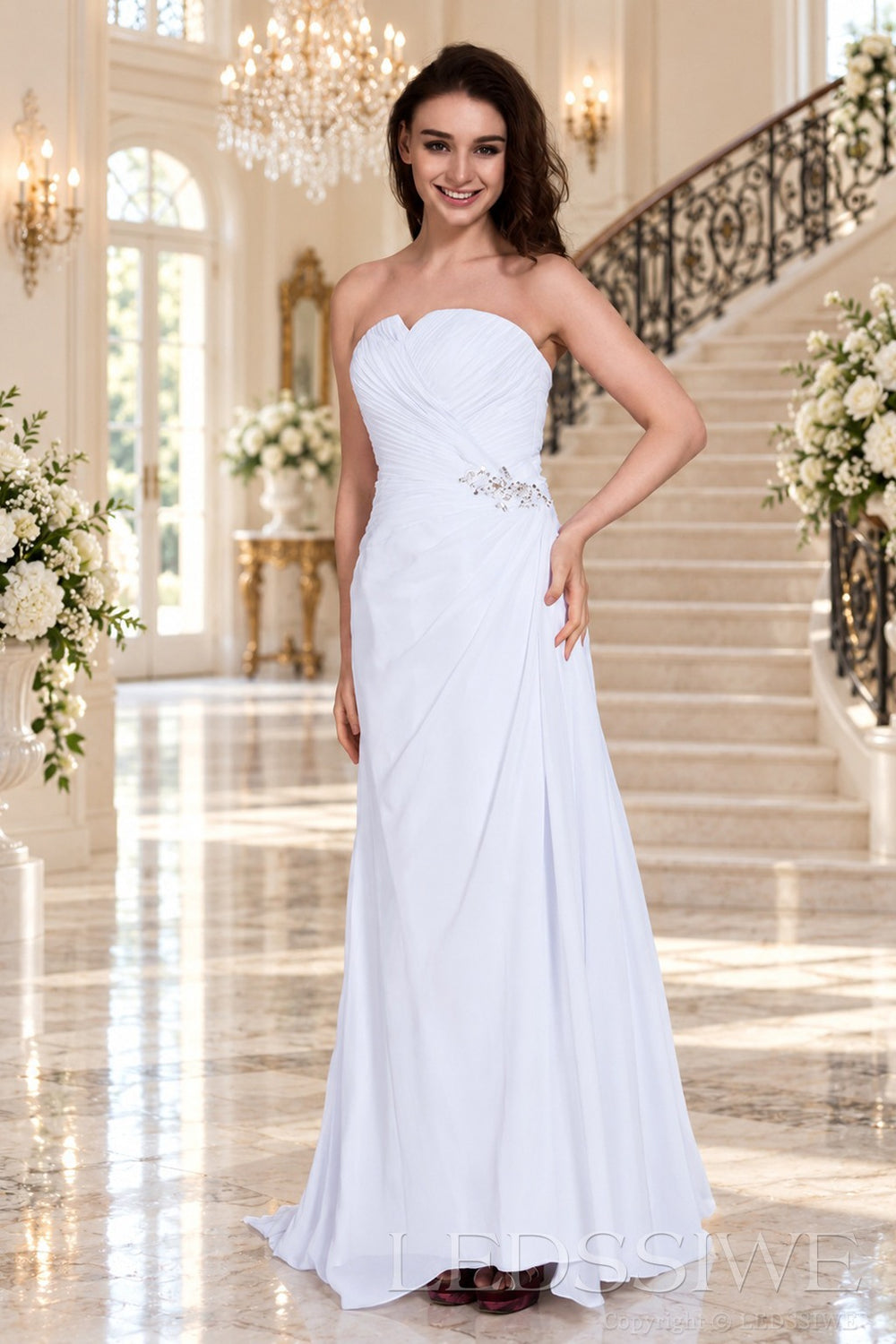 white strapless ruched chiffon a-line wedding dress with beaded hip and cathedral train front view