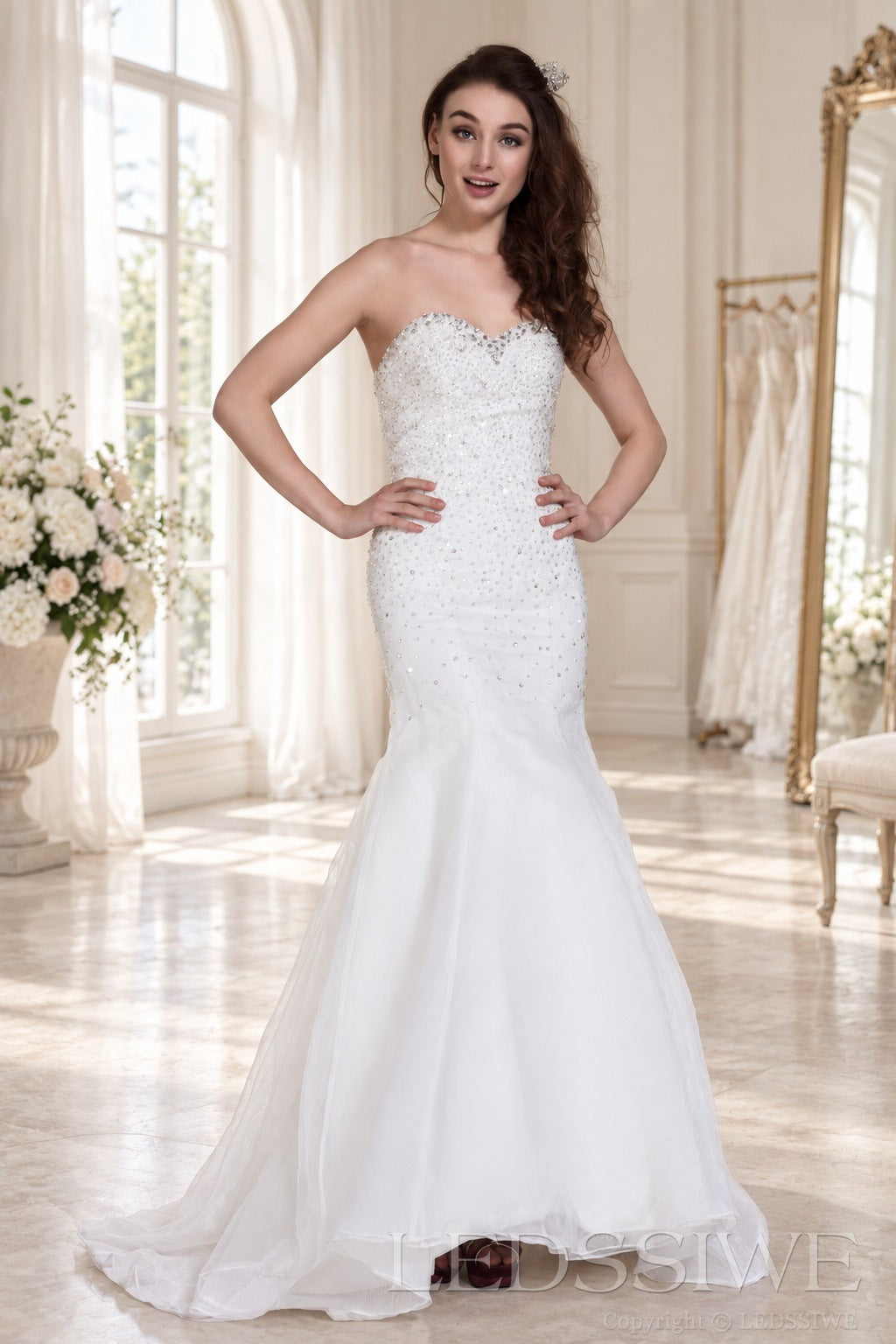 ivory strapless beaded mermaid wedding dress with layered tulle skirt side view
