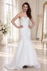 ivory strapless beaded mermaid wedding dress with layered tulle skirt side view