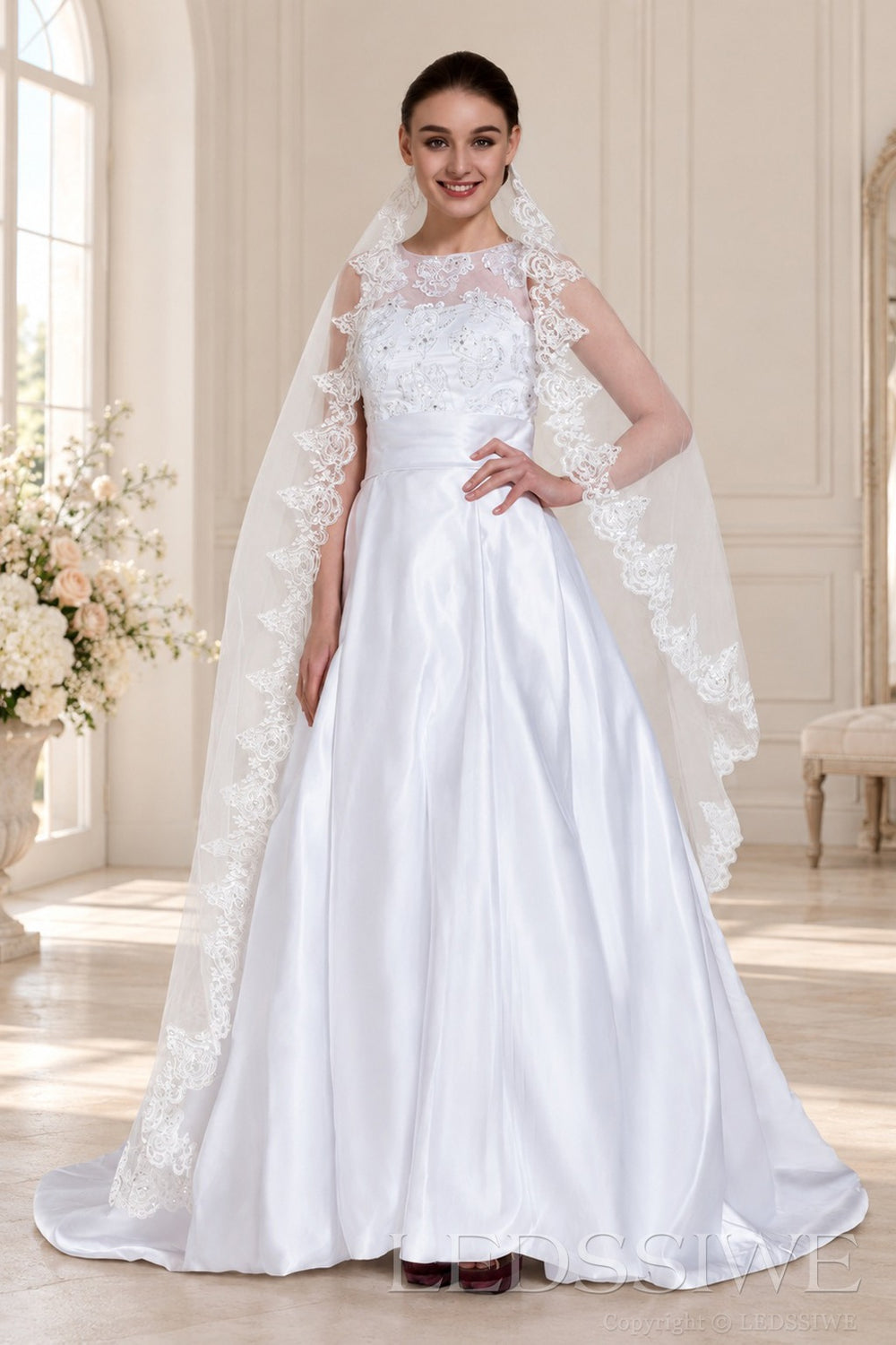 ivory halter beaded satin a-line wedding dress with lace veil cape front view