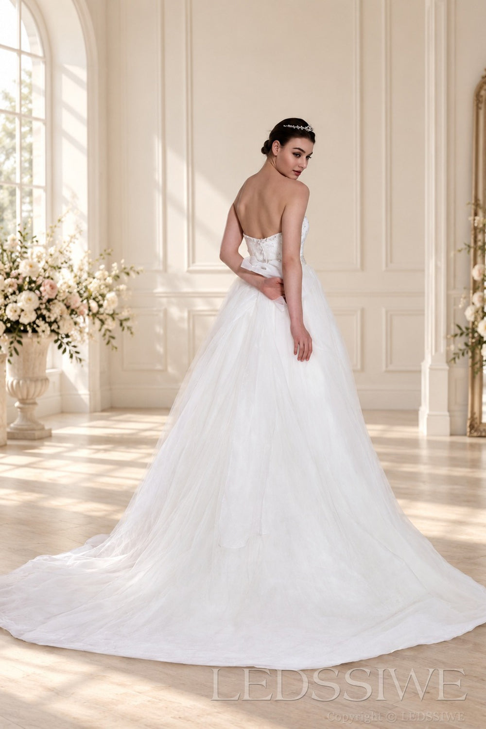 ivory spaghetti strap beaded tulle a-line wedding dress with jeweled belt back view