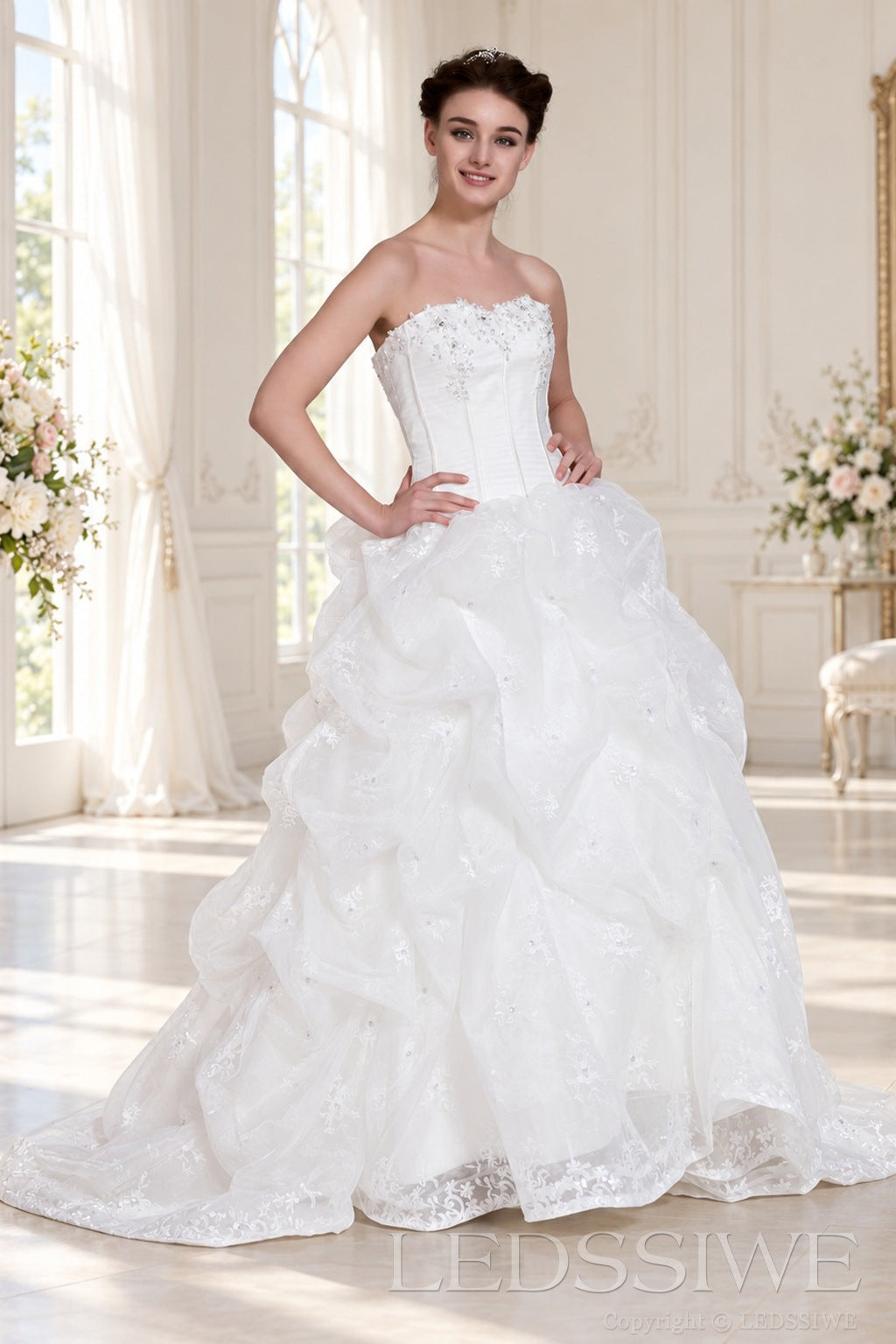 ivory strapless corset ball gown wedding dress with ruffled organza skirt side view