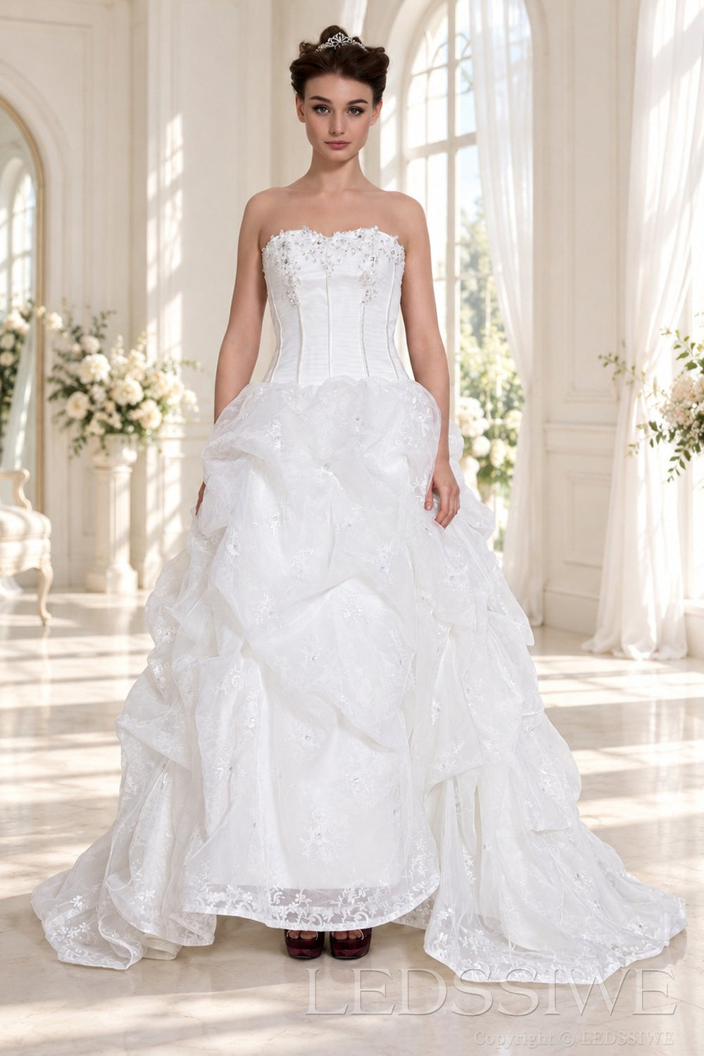 ivory strapless corset ball gown wedding dress with ruffled organza skirt front view