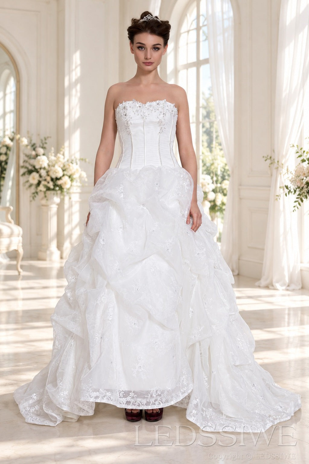 ivory strapless corset ball gown wedding dress with ruffled organza skirt front view