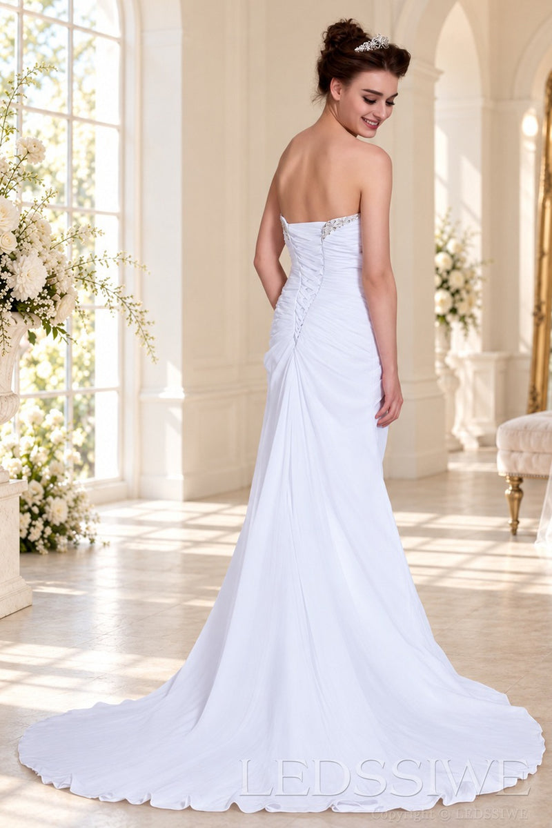 white strapless ruched chiffon mermaid wedding dress with jewel neckline detail back view