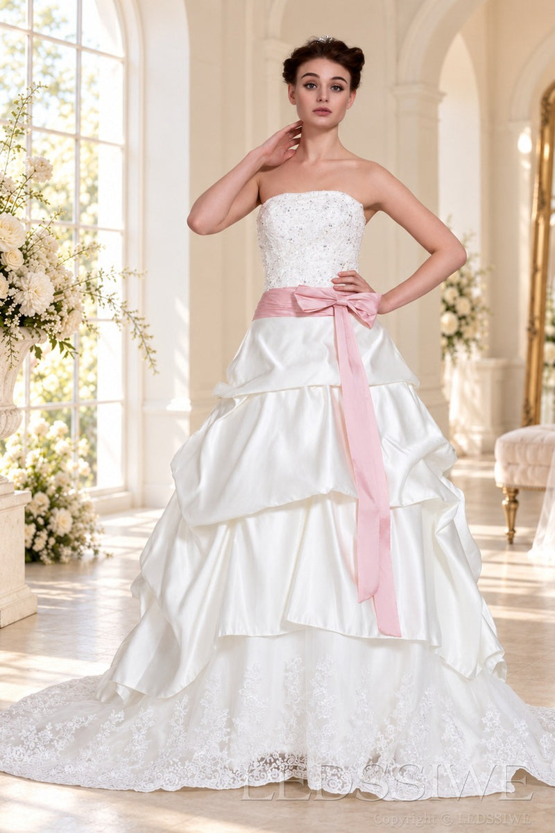 ivory strapless beaded lace ball gown wedding dress with pink satin bow sash front view