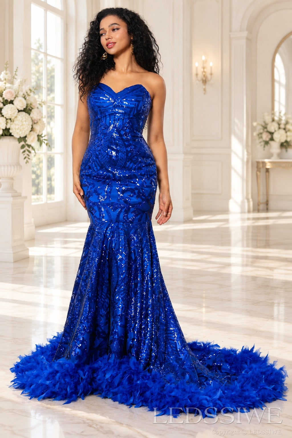 Royal blue sequin mermaid prom dress feather trim train detail