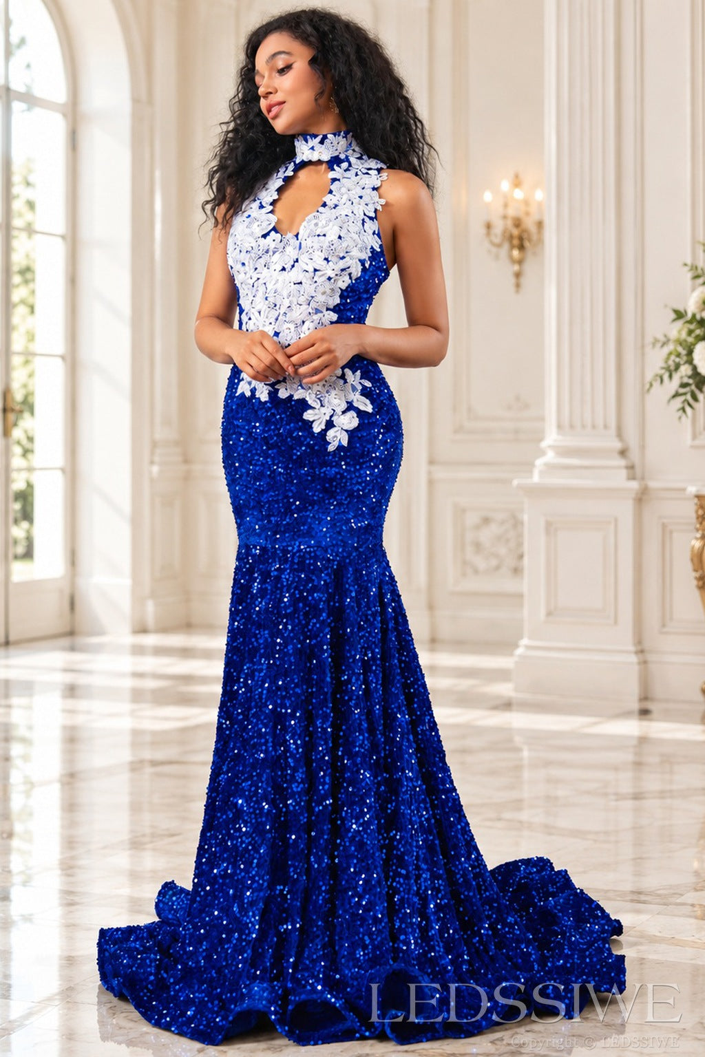 Royal blue sequin halter mermaid prom dress side view floral applique and ruffled train
